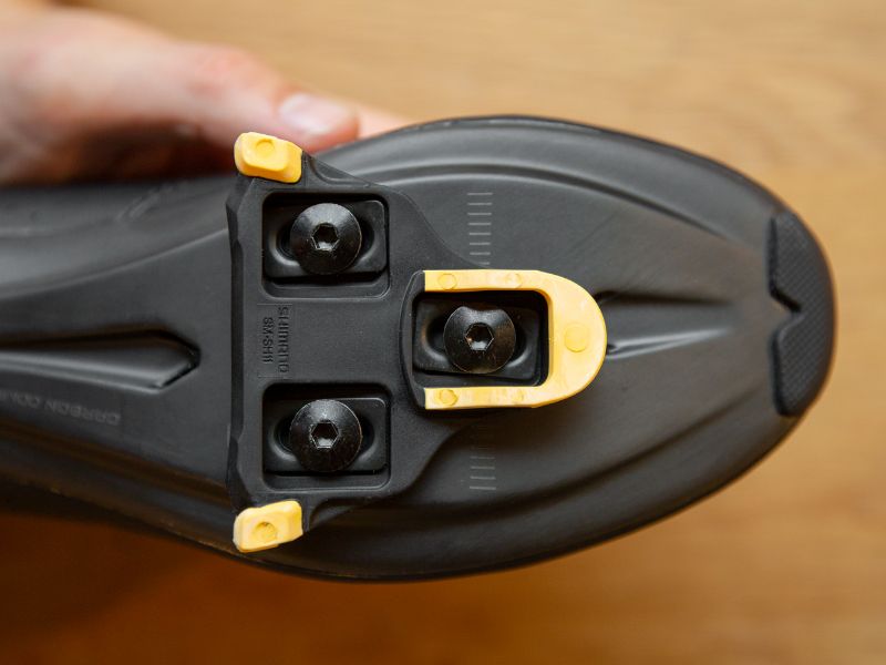 A road bike shoe cleat is almost always secured with 3 bolts.